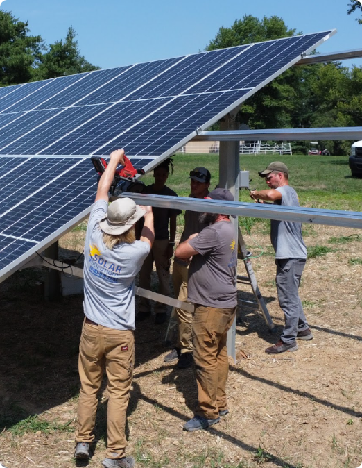 working on a large solar panel array